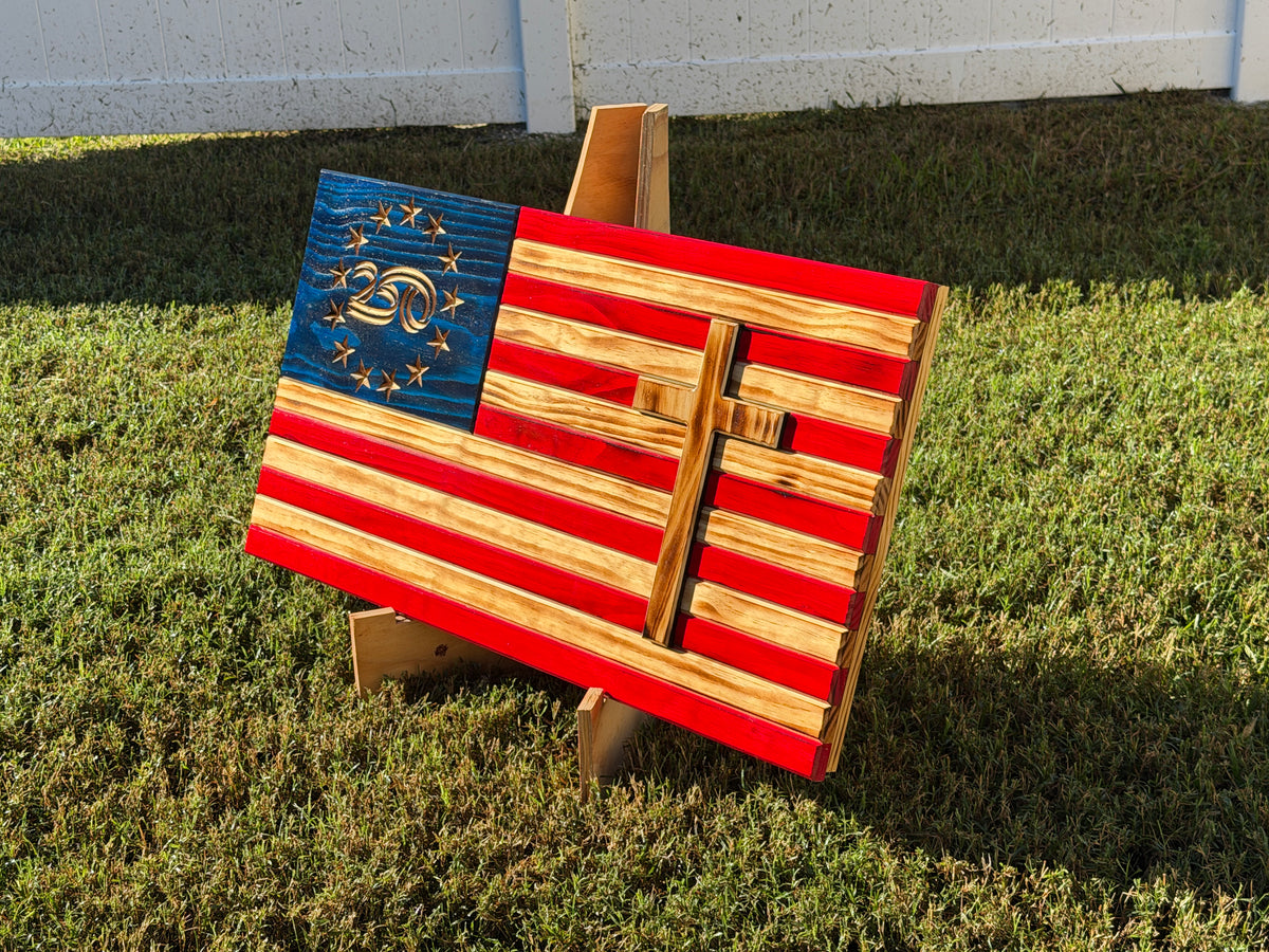 Side-angle view showing the raised wooden cross and rustic wood grain on the American flag
